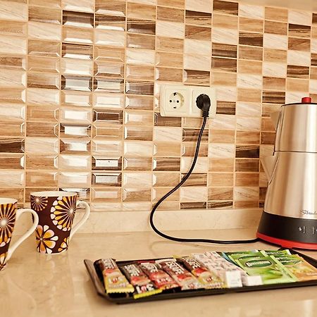 Bursa Suites Apart Otel Exterior foto A kettle plugged into a wall socket